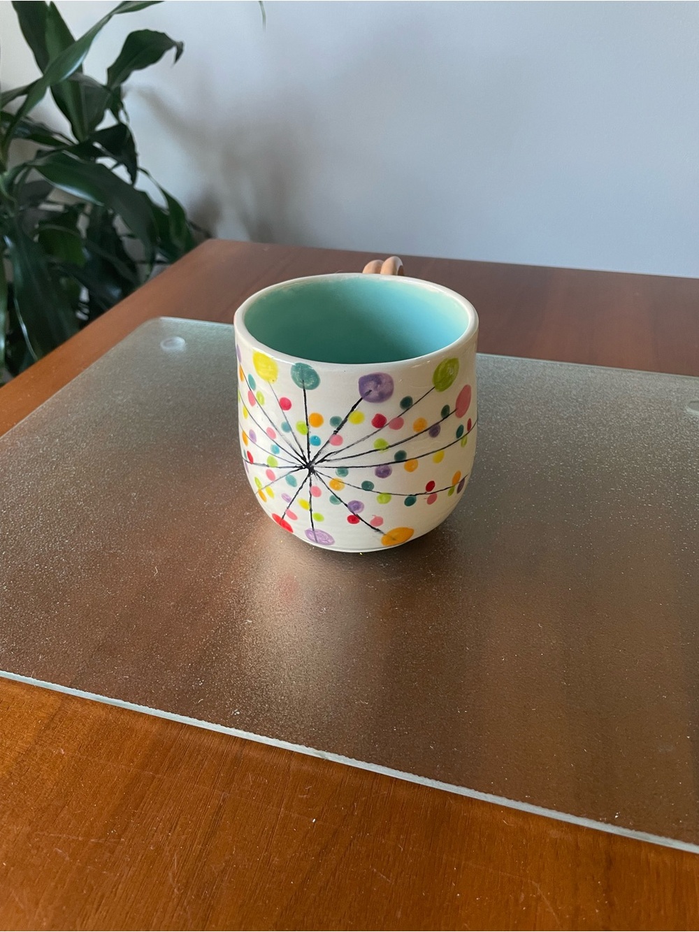 Handcrafted White Ceramic Mug with Turquoise Interior and Multicolor Dot Burst
